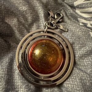 Coach NASA Saturn charm